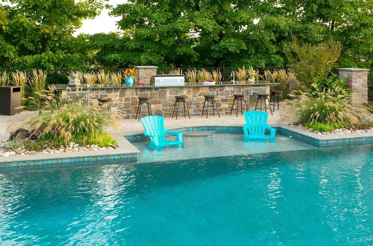 York, PA landscaping and pool design including a kitchen, plantings, lighting, and more.