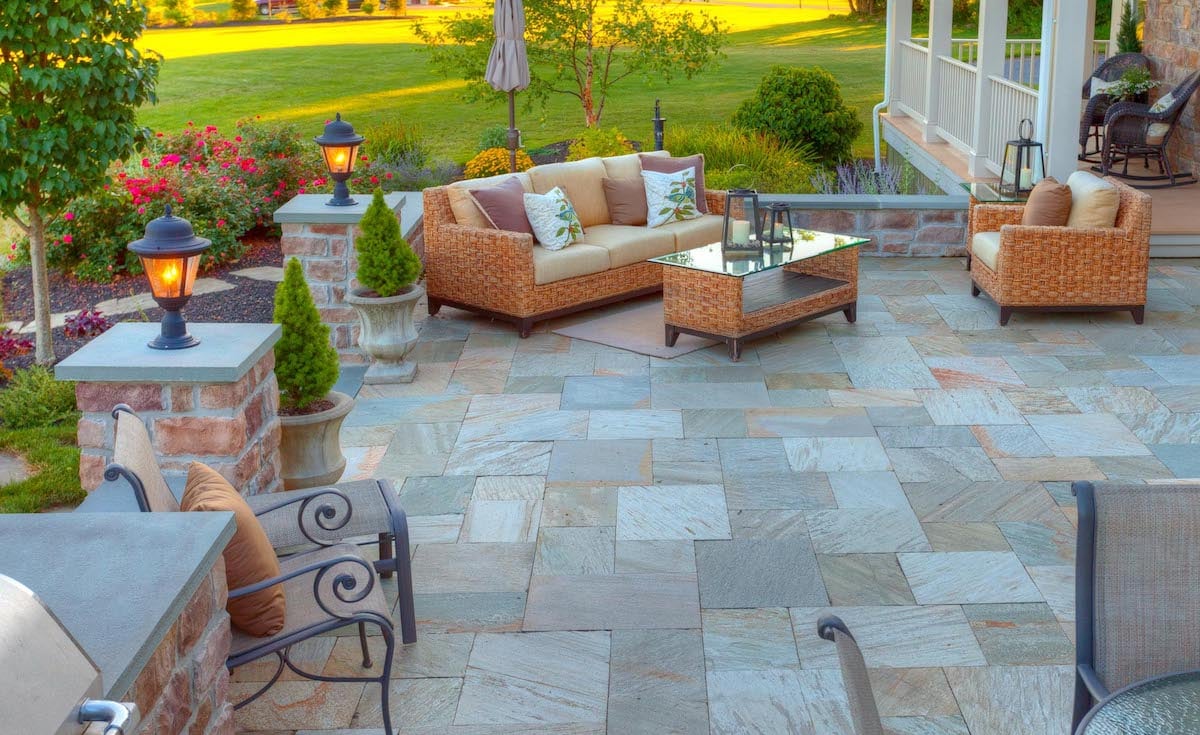 natural stone patio with stone wall