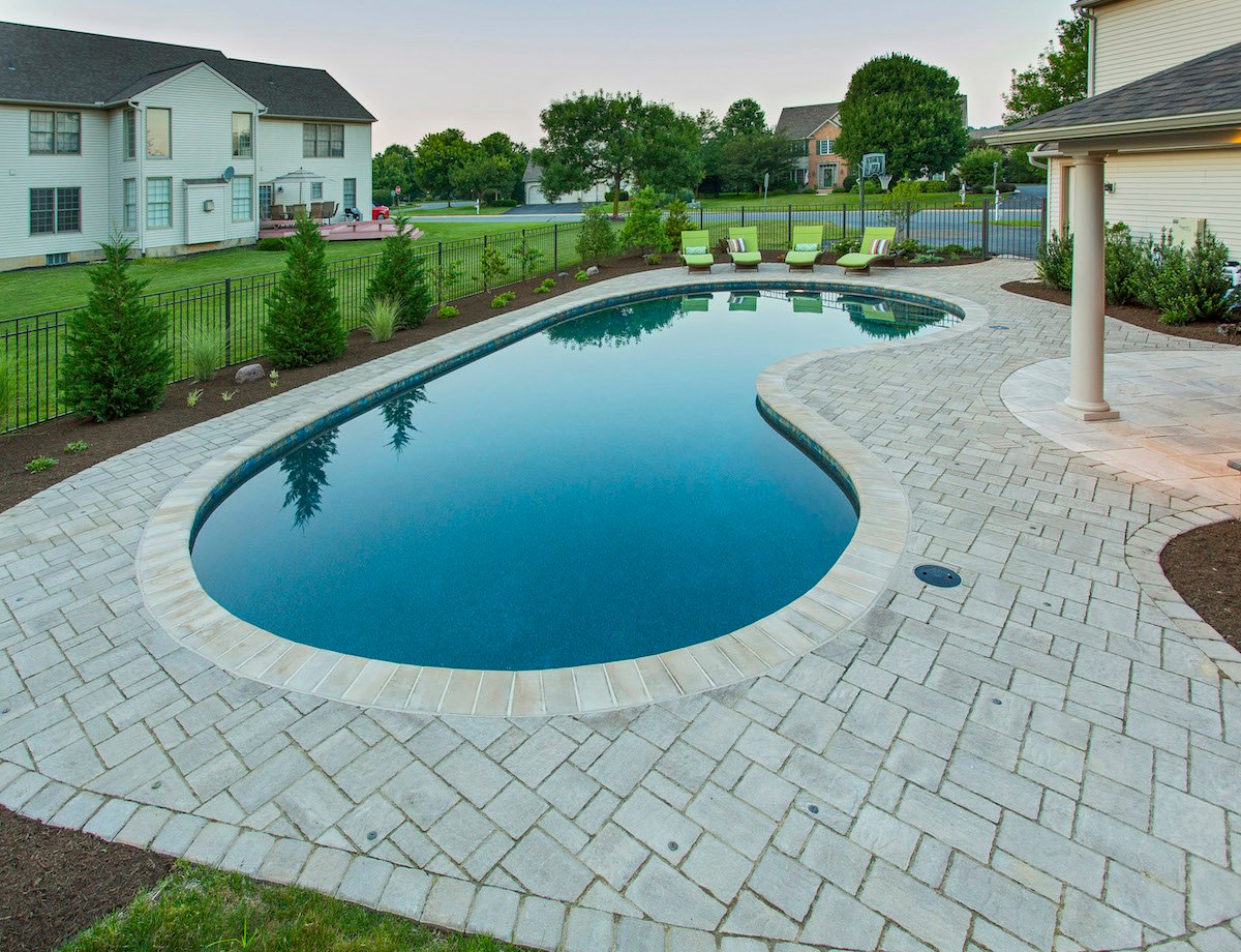 uniquely shaped pool designed by landscaping company in Lancaster, PA