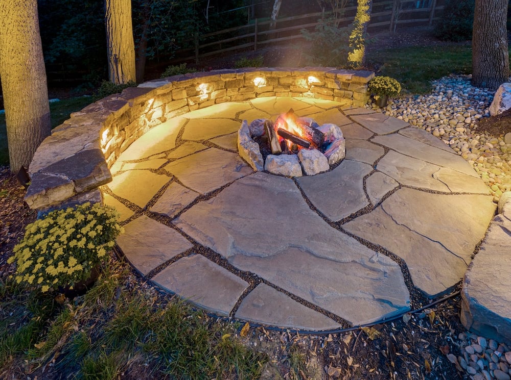 wood burning fire pit with wall and landscape lighting in Reading, PA