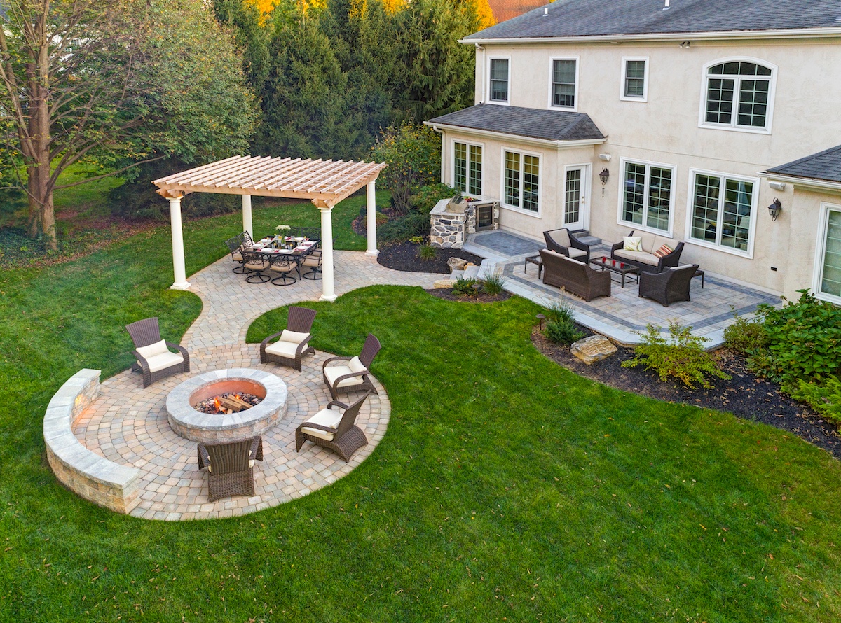 Aerial view of landscape with fire pit, pergola, and patio in Pennsylvania