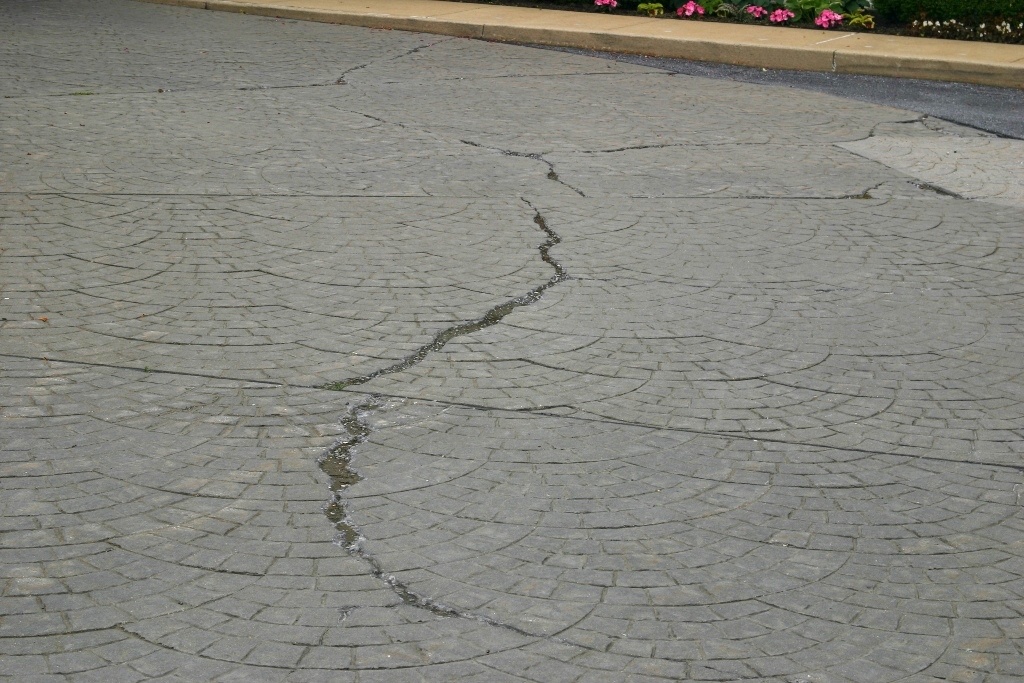 stamped concrete vs pavers vs natural